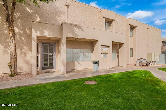 rear view of property with a yard