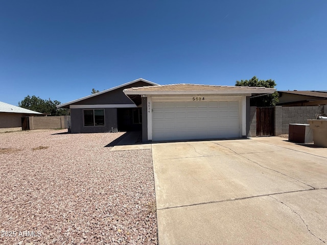 5634 W Puget Ave, Glendale, AZ 85302 - single story home featuring a garage, concrete driveway, and stucco siding