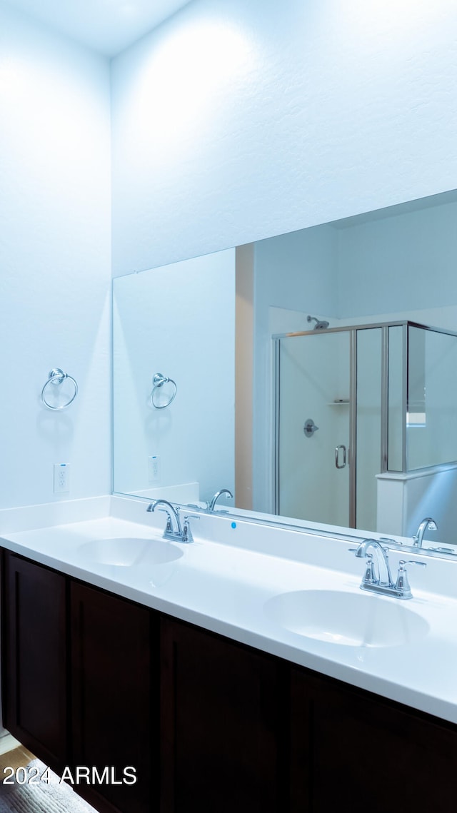 bathroom with vanity and an enclosed shower