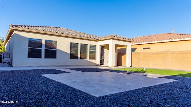 back of house featuring a patio area