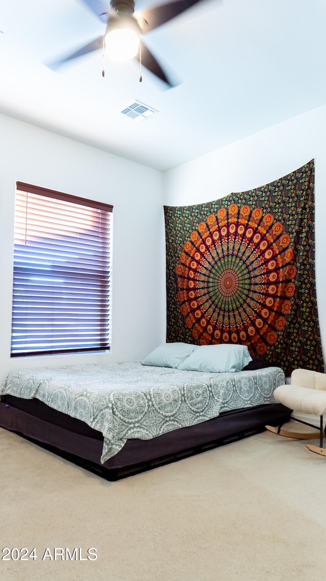 carpeted bedroom featuring ceiling fan