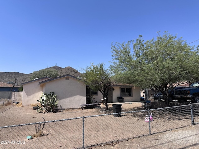 view of front of property with a mountain view