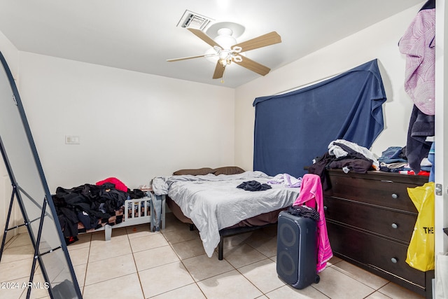 bedroom featuring light tile patterned flooring and ceiling fan