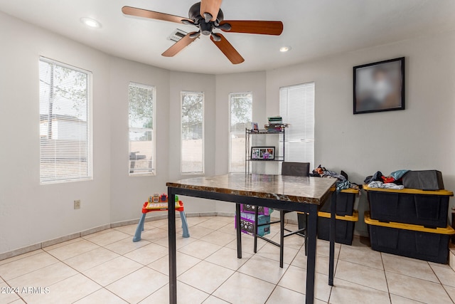 dining room with light tile patterned flooring and ceiling fan