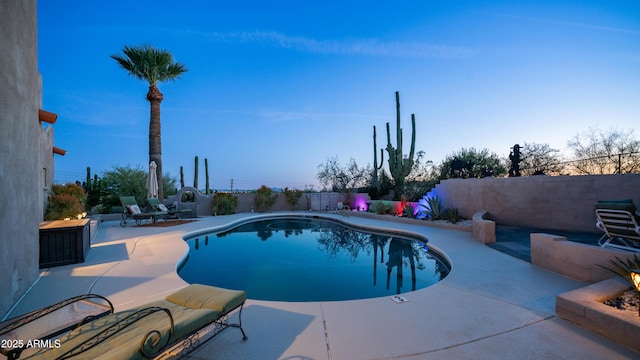 view of pool featuring a fenced in pool, a fenced backyard, and a patio area