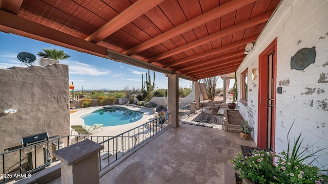 view of pool with a fenced in pool, a fenced backyard, and a patio area