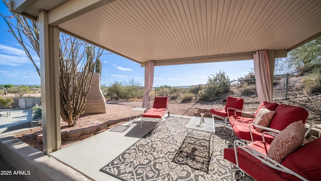 view of patio / terrace featuring an outdoor hangout area and a fenced backyard