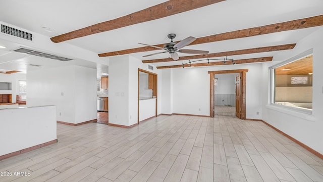 unfurnished living room with baseboards, ceiling fan, beamed ceiling, and visible vents