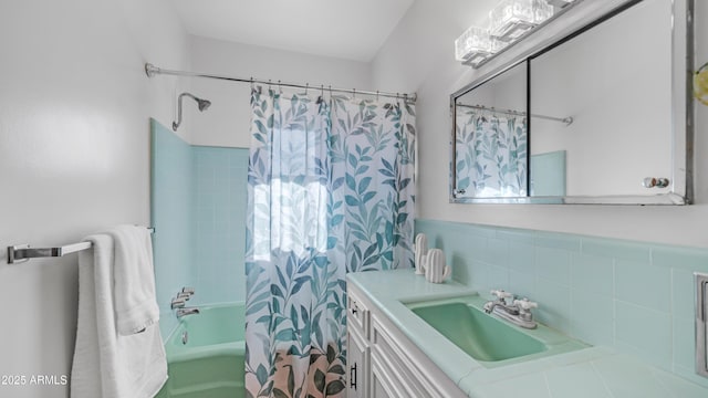bathroom with shower / bath combo and vanity