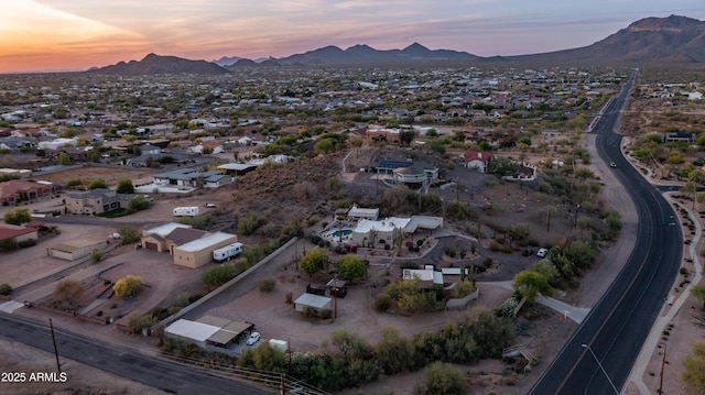 drone / aerial view featuring a residential view and a mountain view