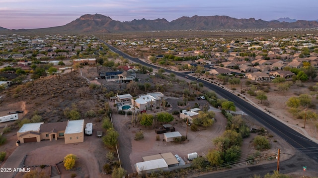 birds eye view of property with a residential view and a mountain view
