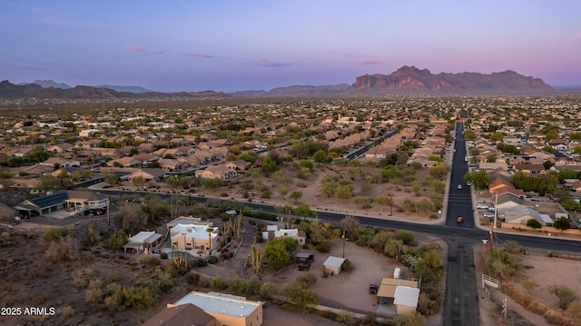 aerial view at dusk with a residential view and a mountain view