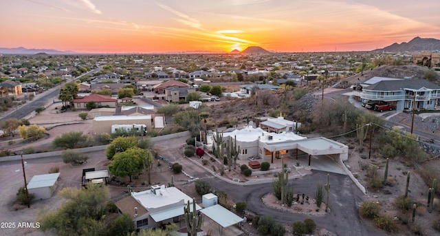 birds eye view of property featuring a mountain view and a residential view