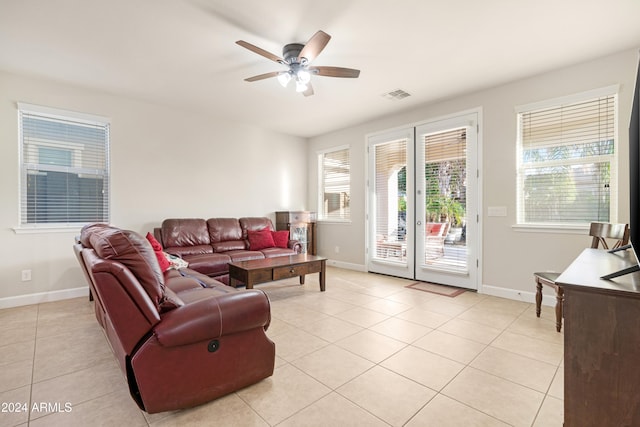 tiled living room featuring ceiling fan