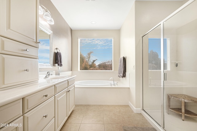 bathroom with vanity, shower with separate bathtub, and tile patterned flooring