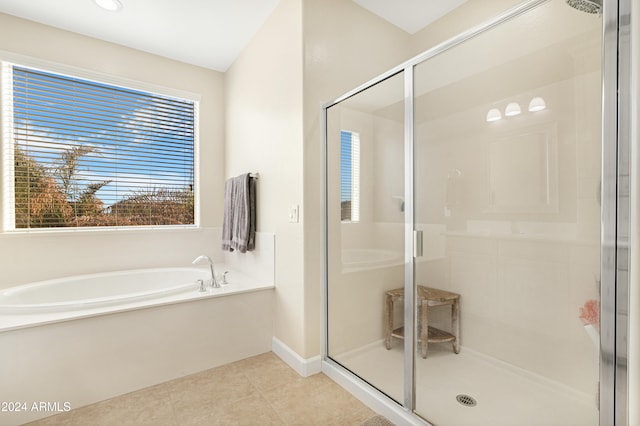 bathroom with tile patterned floors and plus walk in shower