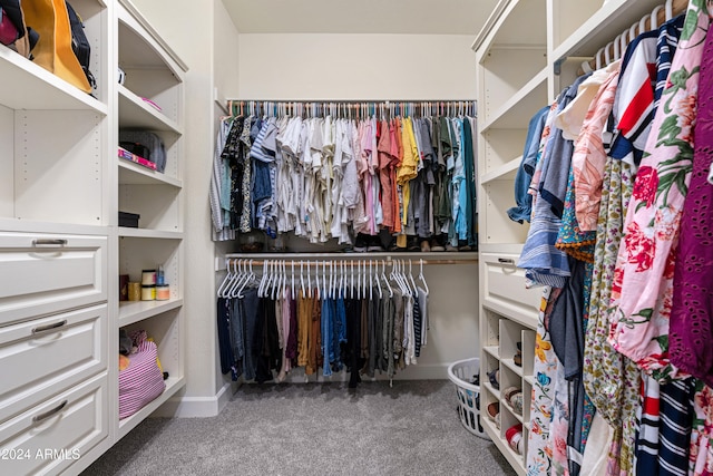 spacious closet with dark carpet