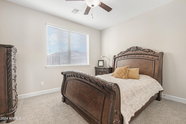 bedroom with ceiling fan and light carpet