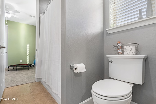 bathroom with toilet, tile patterned floors, and ceiling fan