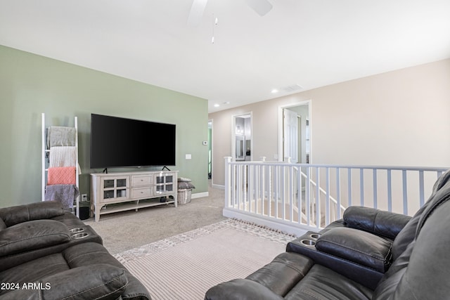 carpeted living room featuring ceiling fan