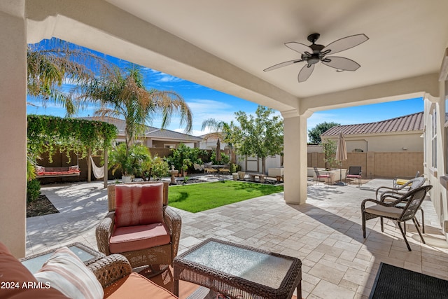 view of patio / terrace with an outdoor living space and ceiling fan