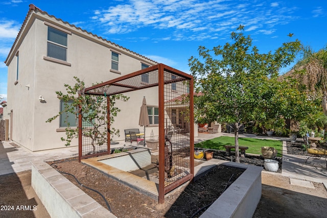 back of property featuring a patio