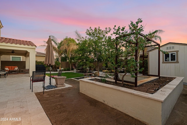 patio terrace at dusk with ceiling fan