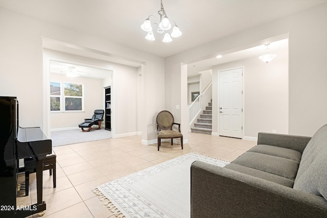 living room featuring a chandelier and light tile patterned floors