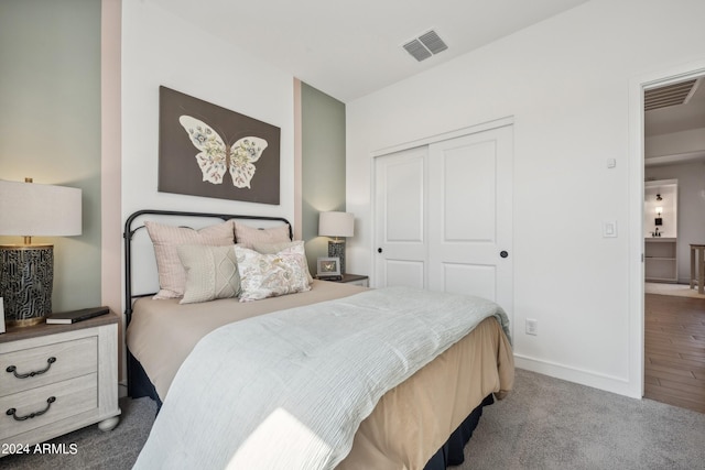 carpeted bedroom featuring a closet