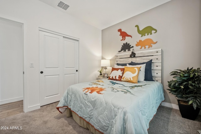 carpeted bedroom with a closet