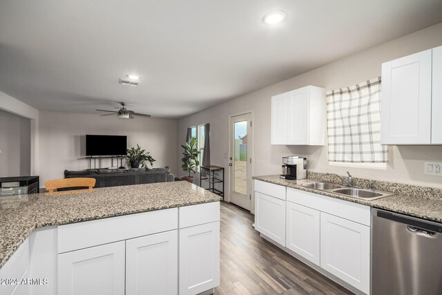 kitchen featuring wood finished floors, a sink, visible vents, white cabinetry, and dishwasher