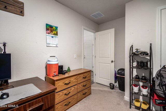 office space with visible vents and light colored carpet