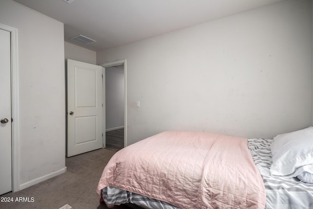 bedroom with carpet flooring, visible vents, and baseboards