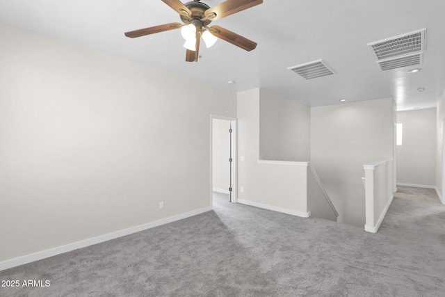 empty room featuring light colored carpet