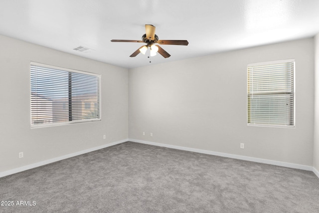 empty room with light colored carpet and ceiling fan