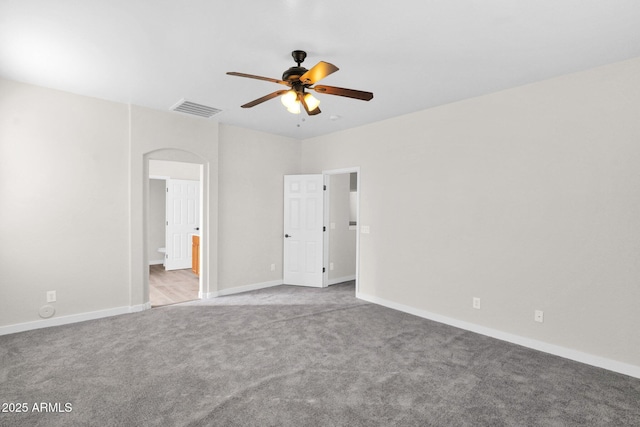 unfurnished room with light colored carpet and ceiling fan