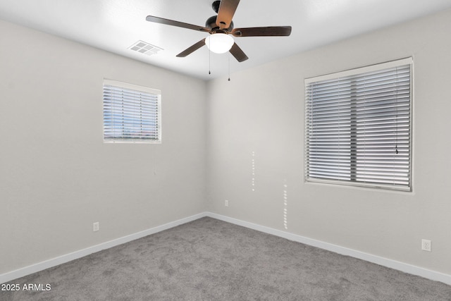 empty room with light colored carpet and ceiling fan