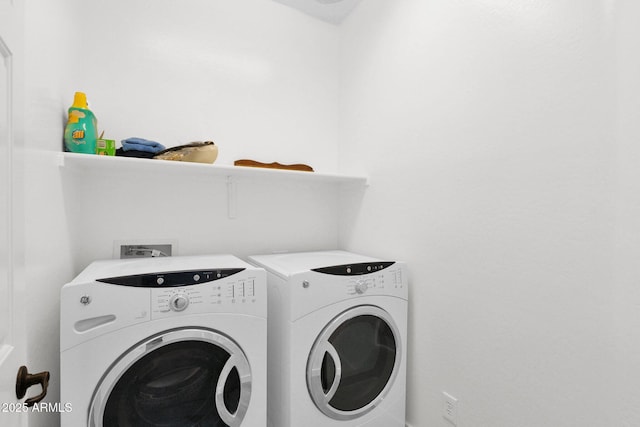 washroom featuring washing machine and dryer