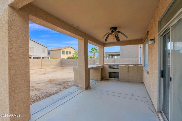 view of patio featuring ceiling fan