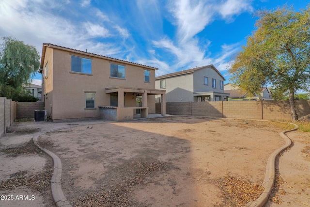 rear view of property featuring a patio area