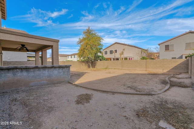 view of yard with a patio and ceiling fan