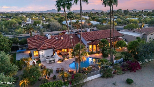 8514 E Country Club Trl, Scottsdale, AZ 85255 - view of subject property featuring a pool area and a mountainous background
