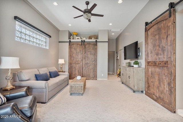 8514 E Country Club Trl, Scottsdale, AZ 85255 - living area featuring a barn door, a ceiling fan, light colored carpet, recessed lighting, and baseboards
