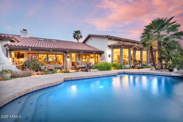8514 E Country Club Trl, Scottsdale, AZ 85255 - rear view of property with a tile roof, an outdoor pool, a chimney, a patio area, and stucco siding