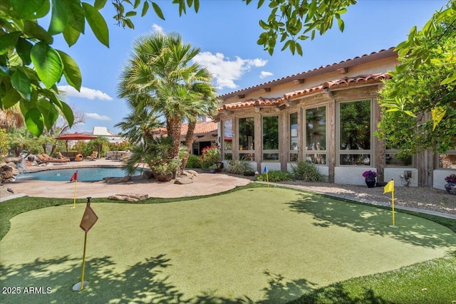 8514 E Country Club Trl, Scottsdale, AZ 85255 - surrounding community with a putting green, a swimming pool, and a patio
