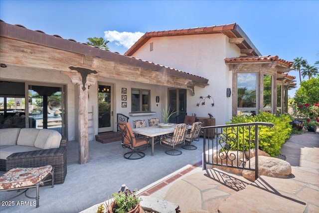 8514 E Country Club Trl, Scottsdale, AZ 85255 - rear view of house featuring a patio, a tile roof, stucco siding, outdoor dining area, and an outdoor living space