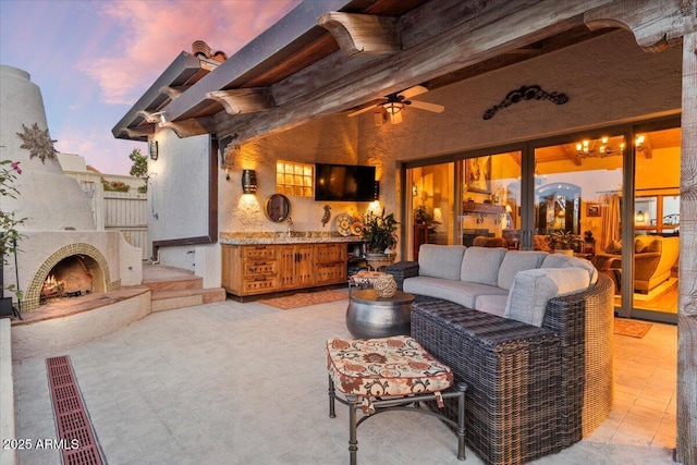 8514 E Country Club Trl, Scottsdale, AZ 85255 - view of patio / terrace with ceiling fan and an outdoor living space with a fireplace
