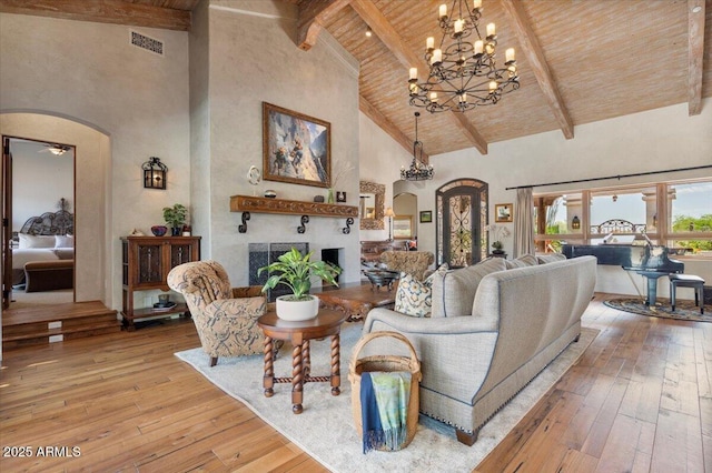 8514 E Country Club Trl, Scottsdale, AZ 85255 - living room featuring arched walkways, wooden ceiling, high vaulted ceiling, beam ceiling, and wood-type flooring
