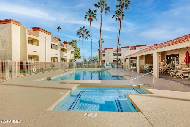 view of swimming pool with a patio