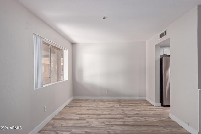 empty room featuring light hardwood / wood-style floors